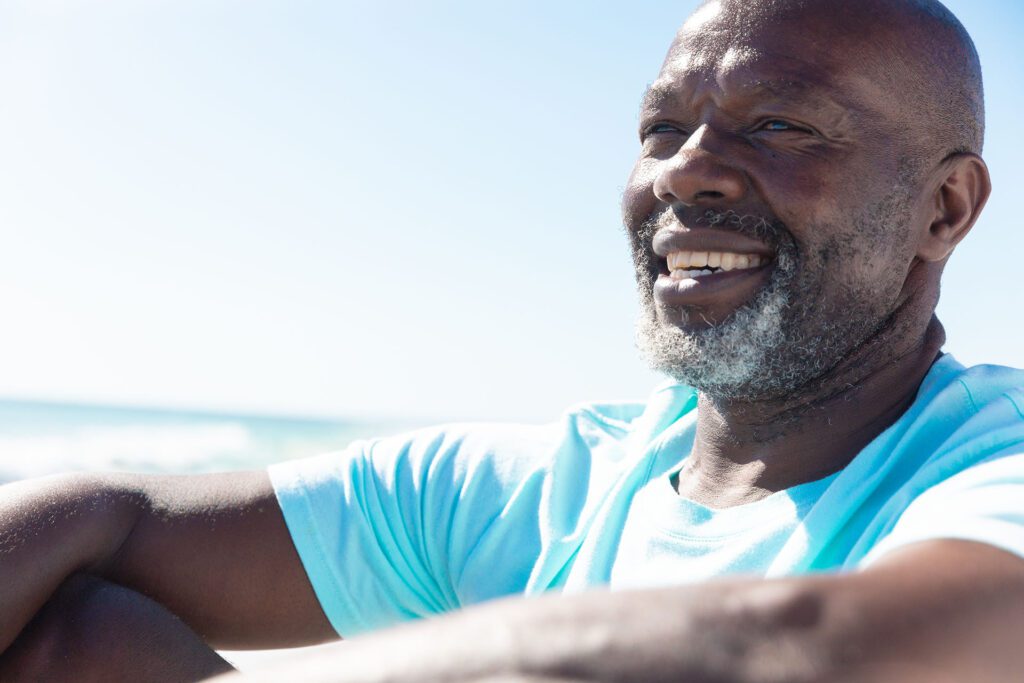 Retired man with grey beard showing off his big smile after Beverly Hills Ortho Treatment