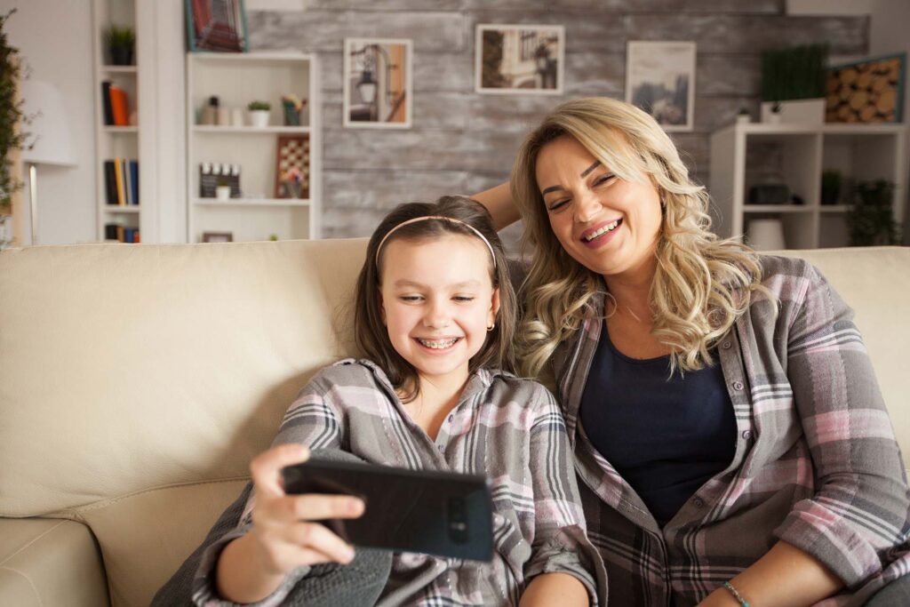 young-girl-with-braces-and-her-mother-take-a-selfie-los-angeles