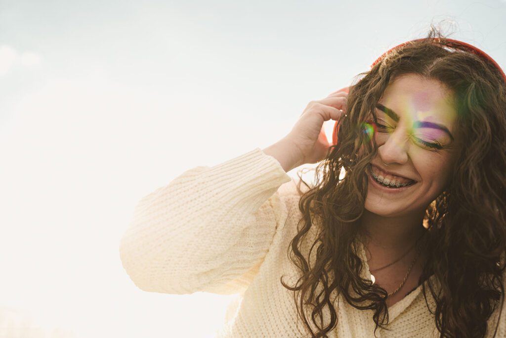 young-woman-with-tooth-brace-listening-to-music-in-los-angeles