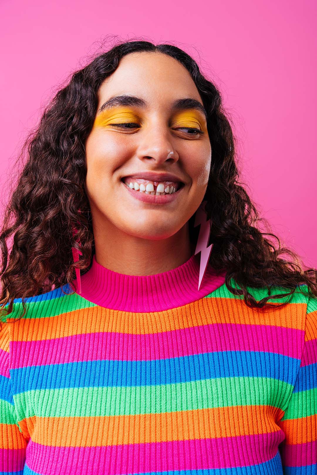 girl in colorful attire with a gap in her front teeth